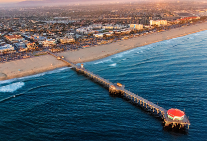 Aerial view of the Huntington Beach Pier at sunset in California.